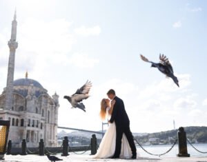 couple of brides standing on city and sea background in istanbul