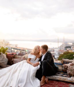 wedding couple posing on sunset city landscape
